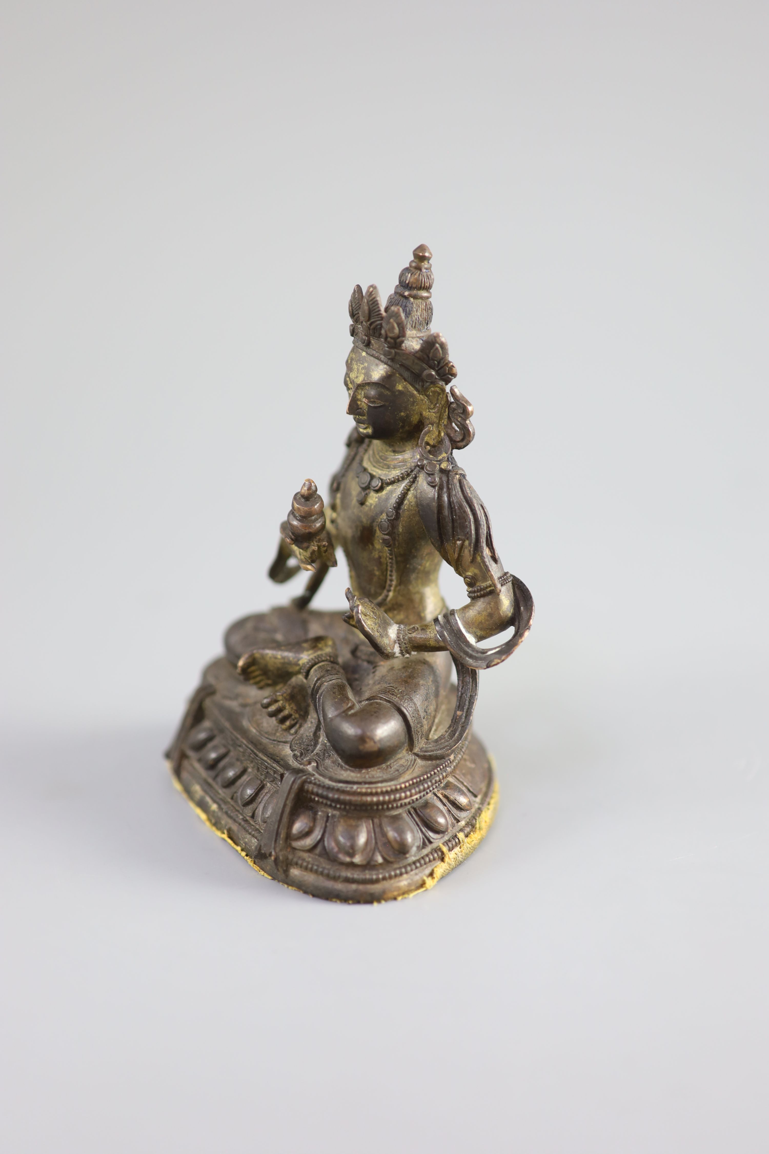A Chinese gilt bronze figure of Amitayus, Qianlong mark and period (1736-95), 12.5 cm high